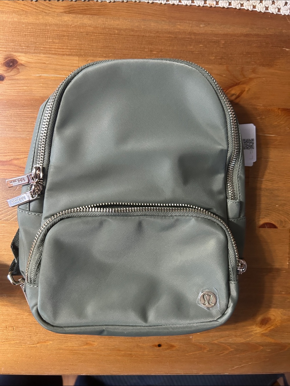 lululemon athletica sage green mini backpack with silver hardware